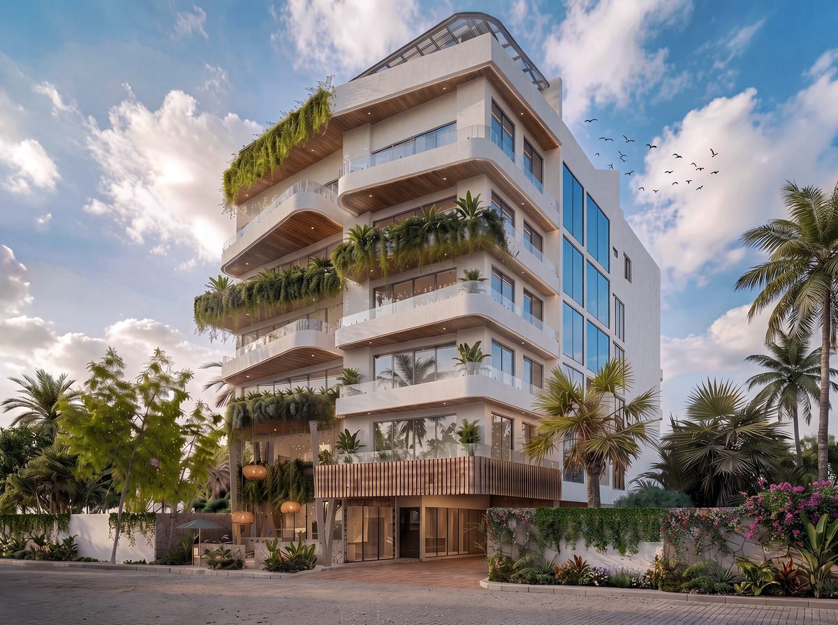 Fachada del desarrollo Sensum: edificio blanco de seis niveles con balcones curvos, jardineras colgantes y vegetación tropical.